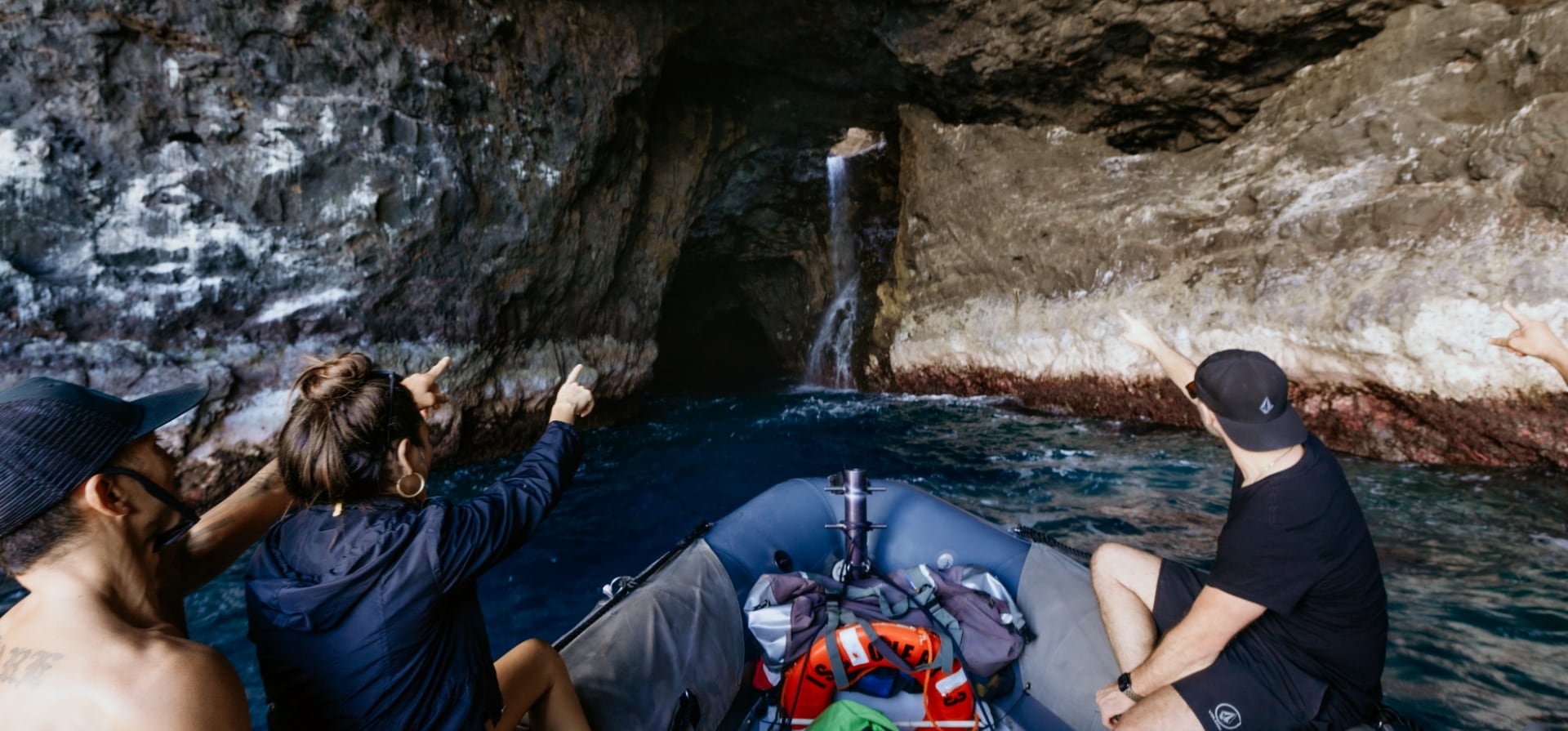 A raft from Captain Andy's navigates the stunning sea caves