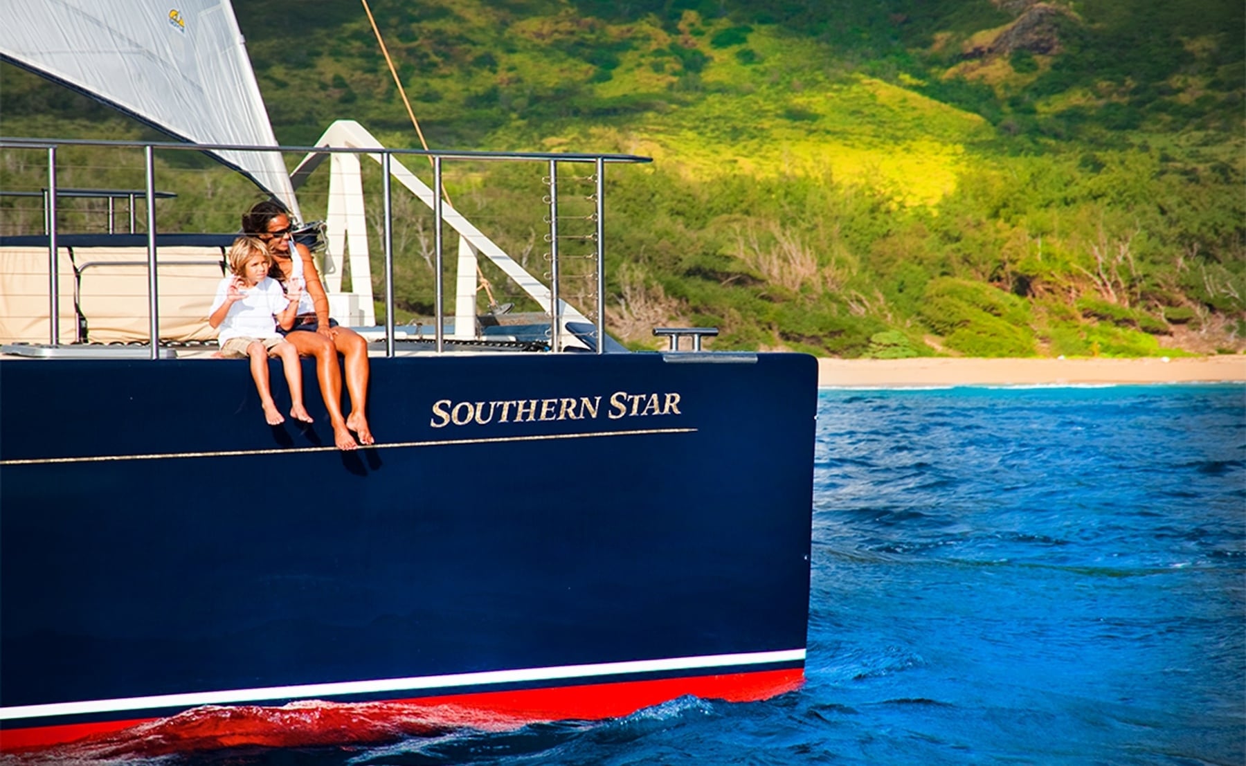Captain Andy's luxury catamaran, Southern Star, sails near the Na Pali Coast