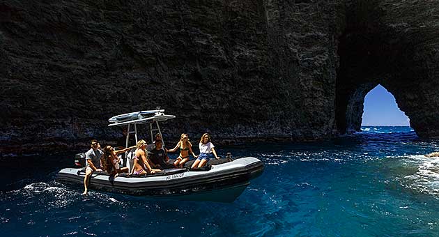 Speed boat tour in Zodiac boat Kauai in the Napali open ceiling sea cave.